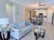 Spacious living room offering an open floor plan and modern furnishings with lots of natural light at 12000 Tapestry Ln, Venice, FL 34293