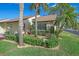 Attractive attached home with lush landscaping and palm trees at 1211 Capri Isles Blvd # 96, Venice, FL 34292