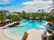 Resort-style pool with a water slide and shaded seating areas at 12232 Stuart Dr, Venice, FL 34293