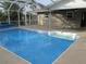 Enjoy this refreshing pool with a screened enclosure at 2084 Haskell St, Port Charlotte, FL 33952