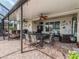 Spacious covered patio with outdoor kitchen at 2183 Nettlebush Ln, Venice, FL 34292