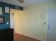 Simple hallway with light-yellow walls and wood floors at 220 Santa Maria St # 136, Venice, FL 34285