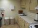 Small kitchenette with sink and cabinets at 220 Santa Maria St # 136, Venice, FL 34285