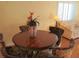 Bright dining area with round table and four chairs, adjacent to a living area at 220 Santa Maria St # 136, Venice, FL 34285