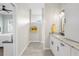 Stylish bathroom featuring modern vanity, granite countertops, updated fixtures, and a walk-in shower at 2228 Lynx Run, North Port, FL 34288