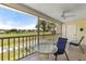 Enjoy the views from this screened-in balcony with a table and chairs overlooking the golf course at 410 Cerromar S Cir # 242, Venice, FL 34293