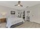 Well-lit bedroom featuring a queen-sized bed and access to the Primary bathroom at 5103 Greencroft Rd, Sarasota, FL 34235