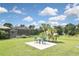 Private patio with seating area, overlooking a spacious backyard at 4241 Chamrade Rd, North Port, FL 34288