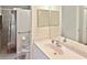 Bathroom with a walk-in shower, single vanity, and toilet at 4241 Chamrade Rd, North Port, FL 34288