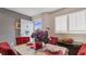 Bright dining area with a table and four red chairs at 1401 S Mccall Rd # 107B, Englewood, FL 34223