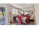 Bright dining room with four chairs and a view to the outside at 1401 S Mccall Rd # 107B, Englewood, FL 34223