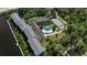 Aerial view of the community with a tennis court and pool at 1401 S Mccall Rd # 107B, Englewood, FL 34223