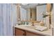 Bathroom with updated vanity and shower/tub at 1401 S Mccall Rd # 107B, Englewood, FL 34223