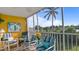 Screened lanai with outdoor seating and a view of water at 1401 S Mccall Rd # 107B, Englewood, FL 34223