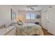 Bright bedroom with double closets and ceiling fan at 1401 S Mccall Rd # 107B, Englewood, FL 34223