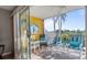 Relaxing screened balcony overlooking lush greenery, perfect for outdoor enjoyment at 1401 S Mccall Rd # 107B, Englewood, FL 34223