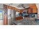 Stainless steel appliances and granite countertops in this kitchen at 1401 S Mccall Rd # 107B, Englewood, FL 34223