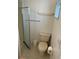 Bathroom with toilet, shower, and tiled floor at 200 Roma Rd, Venice, FL 34285