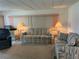 Living room with two sofas, end tables, and lamps at 200 Roma Rd, Venice, FL 34285