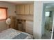 Bedroom with double bed, dresser, and built-in cabinets at 200 Roma Rd, Venice, FL 34285