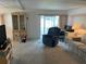 Living room with recliner, TV stand, and built-in hutch at 200 Roma Rd, Venice, FL 34285