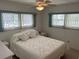 Cozy bedroom with double bed and ceiling fan at 200 Roma Rd, Venice, FL 34285