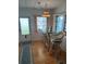 Bright breakfast nook with glass table and wicker chairs at 200 Roma Rd, Venice, FL 34285