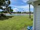 View of a calm lake with lush green landscape at 200 Roma Rd, Venice, FL 34285