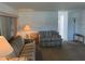Living room with a sofa, end table, and floor lamp at 200 Roma Rd, Venice, FL 34285