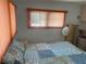 Bright bedroom featuring a double bed and window coverings at 200 Roma Rd, Venice, FL 34285