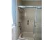 Shower stall with tiled walls and glass door at 200 Roma Rd, Venice, FL 34285