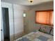 Bedroom with ensuite bathroom and sliding door access at 200 Roma Rd, Venice, FL 34285