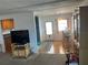 Small dining area with glass-top table and wicker chairs at 200 Roma Rd, Venice, FL 34285
