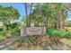Community entrance sign with landscaping at 5103 Greencroft Rd, Sarasota, FL 34235