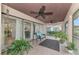 Relaxing screened porch with tiled floor and seating at 5103 Greencroft Rd, Sarasota, FL 34235