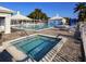 Community pool and spa with lounge chairs and cabanas at 410 Cerromar S Cir # 242, Venice, FL 34293