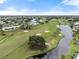 Community overview showcasing golf course and water features at 410 Cerromar S Cir # 242, Venice, FL 34293