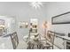 Bright dining area with a view into kitchen at 1211 Capri Isles Blvd # 96, Venice, FL 34292