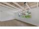 Bright dining area with exposed beams and a modern light fixture at 1757 Mova St, Sarasota, FL 34231