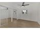 Bedroom with mirrored closet doors and a ceiling fan at 1757 Mova St, Sarasota, FL 34231