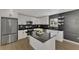 Modern kitchen with white cabinets, quartz countertops, and stainless steel appliances at 1757 Mova St, Sarasota, FL 34231