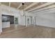 Open living and dining area with exposed beam ceilings and modern light fixture at 1757 Mova St, Sarasota, FL 34231