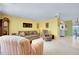 Bright living room with comfy seating and a ceiling fan at 475 Circlewood Dr # O18, Venice, FL 34293