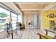 Bright sunroom with seating area and view to backyard at 475 Circlewood Dr # O18, Venice, FL 34293
