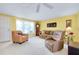 Living room featuring a couch, armchairs, and a grandfather clock at 475 Circlewood Dr # O18, Venice, FL 34293