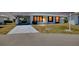 White and gray single-story house with carport and landscaping at 475 Circlewood Dr # O18, Venice, FL 34293