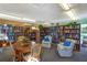 Community library with bookshelves, comfy seating, and a reading table at 475 Circlewood Dr # O18, Venice, FL 34293