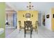 Small dining area with glass top table and four chairs at 475 Circlewood Dr # O18, Venice, FL 34293