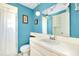 Bathroom with shower, white vanity, and blue walls at 475 Circlewood Dr # O18, Venice, FL 34293