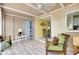 Sunroom with access to dining area and kitchen at 475 Circlewood Dr # O18, Venice, FL 34293